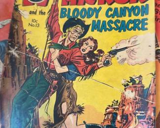 Wild Bill Hickok Bloody Canyon — Classic Wild Bill Hickok comic titled "Bloody Canyon Massacre" featuring western action and pulp-style cover art. Paperback comic shows interior panels with vintage coloring and speech balloons; cover reads 10c No.13 and includes a "Classics Illustrated" piece visible beneath. Measures approximately standard comic size with light edge wear, creases, and toned pages consistent with age; spine shows handling wear but pages appear intact. Overall condition is fair for a mid-20th-century pulp comic; good display piece for collectors of western comics though not graded.