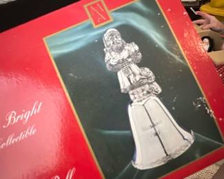 1997 Silverplated Santa Bell — 1997 Making Spirits Bright second edition collectible silverplated Santa bell in original red presentation box. The box shows a photo of the silverplated Santa-top bell and likely contains the bell and paperwork; colors conform to seller note (red box). Boxed holiday collectible ideal for display or seasonal decor. Measurements approximate the boxed item size; condition appears good for sale with some shelf wear to the box visible in photos.
