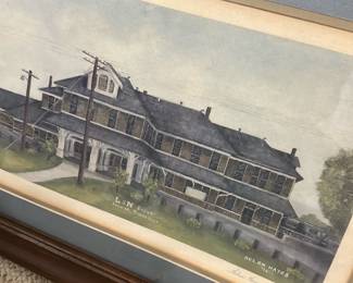 L&N Depot Framed Print — Framed watercolor print titled 'L&N Depot, Crossville, Tennessee' signed by Helen Hayes (visible). The piece is double-matted in blue and cream with a wide wood frame showing surface wear and small nicks; glass appears intact. Overall framed size estimated for wall display; suitable for home or office railroad or local Tennessee decor. Condition is good for display with cosmetic wear to frame and slight mat discoloration consistent with age.