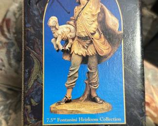 Fontanini Micah 7.5" Nativity — This Fontanini Micah 7.5" figure from the Fontanini Heirloom Collection (Roman, Inc.) is a collectible nativity piece in its original box. The box artwork shows Micah carrying a lamb; piece is listed as 7.5" in the collection labeling and marketed by Roman, Inc. Great for collectors of Fontanini nativity sets or holiday displays. Box shows shelf wear and corner dings consistent with storage; condition of the figure inside is unknown but boxed.