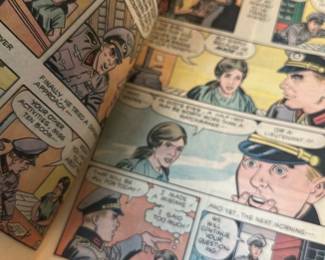 The Hiding Place Comic Book — The Hiding Place comic by Corrie ten Boom is a mid-century Christian-themed comic book with illustrated wartime scenes and moral dialogue. The softcover issue shows interior full-color comic pages and a glossy illustrated cover in red, yellow and blue. Measures approximately 10.5 inches tall and 7.25 inches wide (standard comic size); light wear to cover edges and minor spine creasing but pages remain intact. Good collectible condition for display with expected handling wear and no major tears visible.
