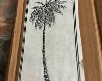 Nativity palm tree (balsa wood) — Nativity palm tree carved from balsa wood included in seller notes and shown in original box. Lightly carved trunk with attached carved fronds and a small base, intended as a nativity or holiday scene accessory. Measures approximately 14 inches tall overall with a 4 inch base footprint (see dimensions), lightweight and easy to display with other nativity figures. Good used condition with minor surface marks from storage; original box included and labeled "BALSA WOOD" and "Donna."