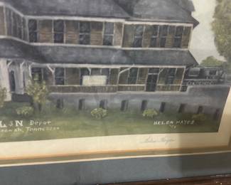 L&N Depot Framed Print — Framed watercolor print titled 'L&N Depot, Crossville, Tennessee' signed by Helen Hayes (visible). The piece is double-matted in blue and cream with a wide wood frame showing surface wear and small nicks; glass appears intact. Overall framed size estimated for wall display; suitable for home or office railroad or local Tennessee decor. Condition is good for display with cosmetic wear to frame and slight mat discoloration consistent with age.