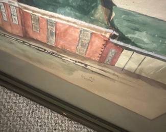 Mason 1976 Framed Watercolor — Framed watercolor architectural study signed "L Mason" dated 1976 depicting a long brick building with green roof. Painted on paper and double-matted in a simple wood frame with glass, the piece shows loose washes and fine line work highlighting doors, chimneys and a covered platform. Overall framed size appears medium and suitable for wall display in a den or hallway; frame and glass remain intact though mats show age spotting. Good estate condition with light surface staining to the lower paper near the signature and typical age wear to the frame.