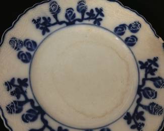 W.A.adams England blue lunch plate — This Wood & Sons Flow Blue plate from England features a beautiful deep blue floral design around a scalloped edge on white porcelain. The plate measures approximately 9 3/8 inches in diameter and shows fine crazing consistent with age, adding vintage charm. It is a classic example of Flow Blue transferware, a collectible style popular in the late 19th and early 20th centuries. The plate is in good condition with no visible chips or cracks, perfect for display or light use. A true piece of English ceramic heritage with a distinctive blue-on-white pattern.