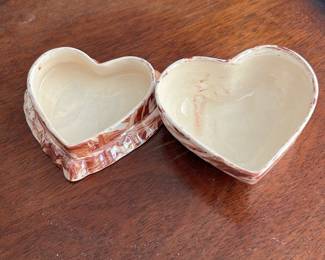 49th Originals Marbled Heart Trinket Box — This charming 49th Originals heart-shaped trinket box features a distinctive marbled pattern in earthy brown and cream tones. Crafted from ceramic, its hinged design reveals a smooth interior perfect for storing small keepsakes. The box measures approximately 3.5 inches wide, 3.5 inches long, and 2 inches tall, making it a compact and decorative accent piece. It is in good condition with minor surface wear consistent with careful use. Marked on the bottom with "49th Originals NC," this piece reflects quality craftsmanship from this maker.