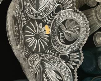 Vintage Hofbauer  Serving Bowl — This vintage pressed glass serving bowl features intricate raised floral and bird motifs with a scalloped edge design. Made from clear glass, it showcases detailed craftsmanship typical of early to mid-20th century pressed glassware. The bowl measures approximately 9.5 inches in diameter and 3 inches in height, perfect for serving or decorative use. It is in good condition with some minor surface wear consistent with age but no chips or cracks. Ideal for collectors or as a charming addition to vintage tableware collections.