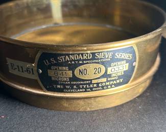 W.S. Tyler No. 20 Standard Sieve — This vintage W.S. Tyler Company No. 20 standard sieve is a precision scientific instrument used for particle size analysis. It is made of durable metal with a fine mesh screen featuring an opening of 841 microns or 0.0331 inches, suitable for laboratory or industrial use. The sieve measures approximately 3 inches tall with a diameter of 8 inches, offering robust construction and reliable performance. It is in good condition with some signs of wear consistent with use but fully functional. Manufactured in Cleveland, Ohio, this sieve is a classic piece from a reputable maker and is ideal for collectors or professionals requiring standard sieve testing equipment.