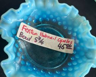 Fenton Hobnail Opalescent Bowl 5.75" — This charming Fenton hobnail opalescent bowl showcases the distinctive blue color with opalescent ruffled edges, a classic example of mid-20th century American art glass. Measuring 5 3/4 inches in diameter, the bowl features the iconic hobnail pattern typical of Fenton's collectible pieces. It is crafted from high-quality glass with excellent craftsmanship evident in its delicate ruffle and vibrant opacity. The bowl is in good condition with minor surface wear but no chips or cracks. A lovely vintage collectible ideal for display or gentle use, prized among glass enthusiasts.