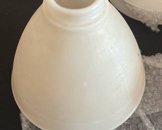 White Textured Glass Lamp Shade — This white textured glass lamp shade features a classic conical shape designed to fit standard light fixtures. The shade has a threaded top opening for secure attachment and showcases a subtle crosshatch pattern on the glass surface. Measuring approximately 6 inches in height and 8 inches in diameter at the base, it is suitable for both vintage and contemporary lamps. The lamp shade is in good condition with minor signs of use but no visible cracks or chips. A practical and elegant replacement part for master bedroom lighting fixtures.