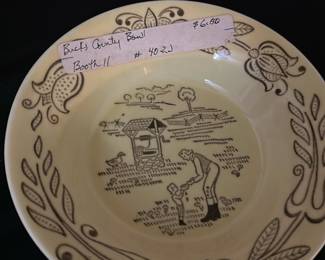 Bucks County Royal Sebring Bowl — This charming Bucks County bowl by Royal Sebring features a detailed countryside design in brown on a cream-colored background. The ceramic bowl depicts a rustic scene with a person drawing water from a well, bordered by floral motifs. It measures approximately 1.75 inches in height and 8.5 inches in diameter, making it a versatile decorative or functional piece. The bowl is in good condition with minor surface wear consistent with vintage use. Produced by Royal Sebring, Ohio, this bowl reflects mid-20th-century American pottery craftsmanship.