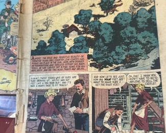 Walt Disney Old Yeller Comic — Walt Disney's Old Yeller comic book featuring full-color illustrated story pages; photographed in Office Up Room. The staple-bound comic shows newsprint paper with age-toned pages and typical edge/tip wear; colors remain visible though faded with foxing and small tears at the spine. Measures approximately 10 inches tall by 7 inches wide with a thin 0.1-inch depth (newsprint comic size) and is lightweight and easy to mail or pick up. Condition is fair with detached or weakened staples, chipped edges, and general handling wear consistent with its age; pages appear complete from photographed sections but may have additional fragility.