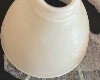 White Textured Glass Lamp Shade — This white textured glass lamp shade features a classic conical shape designed to fit standard light fixtures. The shade has a threaded top opening for secure attachment and showcases a subtle crosshatch pattern on the glass surface. Measuring approximately 6 inches in height and 8 inches in diameter at the base, it is suitable for both vintage and contemporary lamps. The lamp shade is in good condition with minor signs of use but no visible cracks or chips. A practical and elegant replacement part for master bedroom lighting fixtures.