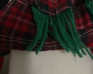 Red Plaid Penguin Holiday Figure — Charming plush penguin holiday figure dressed in red plaid with a matching hat and green fringe scarf. Made of soft felt and fabric with stitched facial features and a weighted plush base to stand upright on shelves or mantels. Measures approximately 14 inches tall with a sturdy base making it an easy seasonal display piece. Good used condition with light surface dust and a small fabric pull on the base noted in photos.