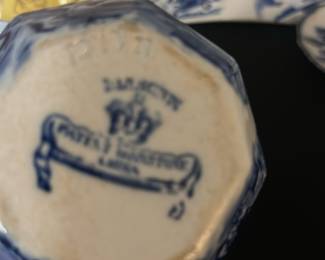 Patent ironstone small picture — This charming Johnson Bros creamer pitcher features a classic blue and white transferware pattern with floral and pastoral motifs. Made of fine china with a distinctive octagonal shape and decorated handle, it adds a vintage English country style to any collection or table setting. Measuring approximately 4.5 inches tall, this piece is sturdy yet delicate, perfect for serving cream or milk. The condition is good with minor signs of wear and no visible chips or cracks. Marked with the Johnson Bros 'Lesley' pattern stamp, it reflects the renowned English pottery craftsmanship known for quality and style.