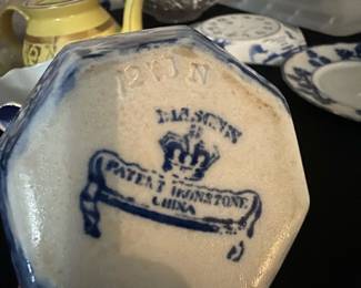 Patent ironstone small picture — This charming Johnson Bros creamer pitcher features a classic blue and white transferware pattern with floral and pastoral motifs. Made of fine china with a distinctive octagonal shape and decorated handle, it adds a vintage English country style to any collection or table setting. Measuring approximately 4.5 inches tall, this piece is sturdy yet delicate, perfect for serving cream or milk. The condition is good with minor signs of wear and no visible chips or cracks. Marked with the Johnson Bros 'Lesley' pattern stamp, it reflects the renowned English pottery craftsmanship known for quality and style.