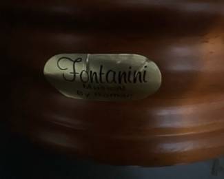 Fontanini Nativity Musical Globe — This Fontanini musical nativity globe features a detailed resin holy family scene inside a clear globe mounted on a turned wood-tone base. The piece is marked "Fontanini" on a metal label on the base and appears to be the boxed musical decoration often sold for holiday display. Measures approximately 9 inches tall with a 6.5 inch globe diameter and sits on a 6.5 inch round base. Overall good condition with light surface wear to base and no visible cracks in the globe; original box pictured but may show storage wear.