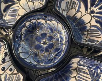 Blue Ceramic Chip & Dip Serving Set — This beautiful blue ceramic serving set features a chip and dip style arrangement with five pieces, each decorated with intricate floral and butterfly motifs in blue and cream colors. The set is crafted from glazed ceramic, making it both functional and decorative for entertaining guests. It measures approximately 12 inches wide and 2.5 inches tall, ideal for serving snacks and dips. The pieces are in excellent condition with no visible chips or cracks, showcasing their quality craftsmanship. A charming addition to any table setting or collection, this set is perfect for casual or formal occasions.