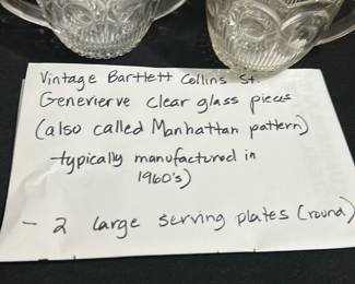 Bartlett Collins cream and sugar — These vintage Bartlett Collins clear glass pieces feature the Genevieve or Manhattan pattern, typically manufactured in the 1960s. The set includes a cream and sugar with distinctive scalloped edges and intricate pressed glass design. Each piece measures approximately 3.5 inches tall and 4.5 inches wide, perfect for serving cream and sugar. The items are in good condition with no visible chips or cracks, showcasing classic mid-century American glassware design. These collectible pieces add a touch of nostalgic charm to any dining or tea setting.
