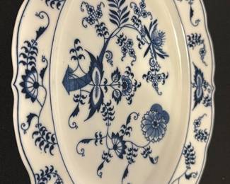 Blue Danube Blue Floral Platter — This Blue Danube platter features a classic blue floral design on white porcelain, showcasing elegant vintage tableware craftsmanship. The platter has a scalloped edge with intricate blue floral motifs both in the center and along the border. Measuring approximately 14 inches in length, it is perfect for serving or display. The piece is in good condition with no visible chips or cracks, displaying slight use consistent with vintage porcelain. Marked with the Blue Danube logo and REG. U.S. PAT. OFF., this platter is a charming addition to any collection or dining set.