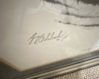 Regency House Art Inc Tiger Print — Regency House Art Inc. framed tiger lithograph featuring a detailed black-and-white tiger head with double mat and gilt-accented frame. The piece is signed by the artist (appears to read Guy Bohabach) in pencil on the lower margin and is presented under glass in a decorative frame. Overall size is estimated for hanging and the work is ready to display from the Bonus Up Room; frame shows normal surface wear and small scuffs visible in photos. In good condition overall with intact glass and matting; minor frame wear consistent with age and handling.