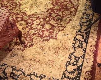Traditional Area Rug 8’x11’ — This traditional floral area rug features an intricate medallion design with a warm color palette of reds, creams, and dark green borders. The rug has a plush pile with detailed floral motifs throughout, adding a classic charming touch to any living space. It is designed to fit comfortably in front room areas, complementing antique or vintage furniture styles. The rug shows gentle signs of use with some minor wear but remains in good condition overall. Its timeless design and quality construction make it a versatile and elegant home decor piece.