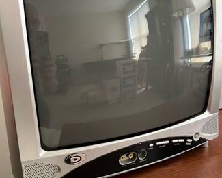 Digital 13in CRT TV — This Digital brand 13-inch CRT television offers a compact and classic viewing experience. Featuring a silver and black casing with front input jacks including AV and headphone jacks, it is designed for small spaces or secondary TV use. The unit measures approximately 13 inches diagonally with overall dimensions near 14 inches wide, 13 inches deep, and 12 inches tall. In good used condition with minor surface wear consistent with age; functionality is not tested. Perfect for nostalgic retro setups or basic video viewing needs.