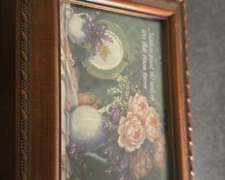 Decorative Wood Music Box — This decorative wooden music box features a framed floral print under glass with a charming vintage style. The box is crafted from dark wood with detailed molding around the edges, and opens to reveal a velvet-lined interior and a compartment for keepsakes. Measuring approximately 3.5 inches high, 5.5 inches wide, and 4 inches deep, it is a tasteful home decor piece ideal for storing small treasures. The music box is in good condition with minor surface wear consistent with age and use. Made for decorative and functional use, it complements traditional or vintage-inspired interiors.