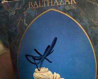 Balthazar Fontanini Figure Box — Balthazar Fontanini Heirloom Collection boxed figure in original packaging showing the three wise men design. Box is dark blue as noted in blue dishes room photos and displays a 7.5" Fontanini Heirloom Collection label on the front; figure likely porcelain/resin Fontanini nativity piece. Measurements are approximate of the boxed piece; box shows wear with tape residue and pen marking on front but appears to contain the figure. Sold as boxed collectible in good estate-sale condition with visible shelf/edge wear to box and signs of previous handling.