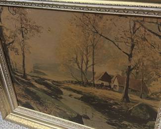 Framed Landscape Oil Painting — Large framed landscape oil painting depicting a riverside cottage scene with trees and muted autumn tones. The work is set in an ornate gold gilt wooden frame with decorative inner moulding; canvas appears to be oil on canvas or board. Overall piece is a substantial wall accent suitable for living room or entry; measurements provided below are approximate. Condition shows age-consistent surface craquelure and light wear to the gilt frame corners and finish but no visible tears to the canvas. No visible signature or maker's mark on the front; sold as decorative estate artwork.