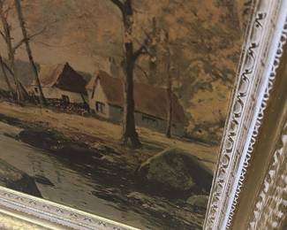 Framed Landscape Oil Painting — Large framed landscape oil painting depicting a riverside cottage scene with trees and muted autumn tones. The work is set in an ornate gold gilt wooden frame with decorative inner moulding; canvas appears to be oil on canvas or board. Overall piece is a substantial wall accent suitable for living room or entry; measurements provided below are approximate. Condition shows age-consistent surface craquelure and light wear to the gilt frame corners and finish but no visible tears to the canvas. No visible signature or maker's mark on the front; sold as decorative estate artwork.