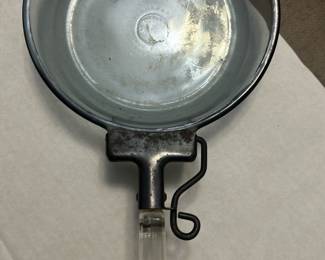 Vintage Pyrex Glass Frying Pan — This vintage Pyrex frying pan features a sturdy glass cooking surface combined with a metal rim and a clear acrylic handle. The pan's base is marked with the Pyrex logo and manufacturing details, confirming its authenticity and classic design. Measuring approximately 11 inches in diameter with a handle length of about 7 inches, this piece is ideal for collectors or vintage kitchen enthusiasts. It shows signs of use consistent with its age but remains structurally sound with no major chips or cracks. A distinctive vintage kitchen collectible that blends glass and metal materials for a unique cooking accessory.