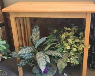 Wooden Console Table with Decorative Planters and Ceramic Figurines