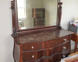 Bow front dresser with mirror
