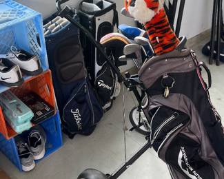 Golf bags, clubs, and accessories, including Sun Mountain, Taylormade, and Titleist brands