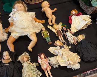 Antique dolls, including 1950s Disney Peter Pan and Tinker Bell, and mid-century play baby dolls