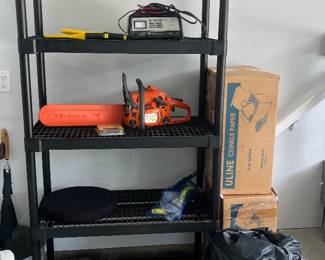 Storage shelf, Husqvarna chainsaw, Schumacher 2/10/50 Amp 12V Battery Charger and Starter, air mattress