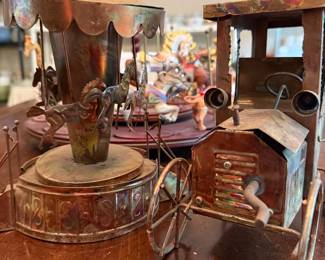 Metal carousel and vintage car