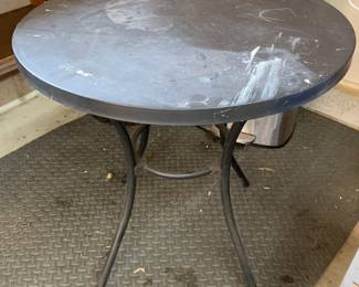#246	black metal round table on legs 26x28	 $40.00 