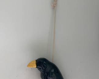 #151	black crow ceramic hanging with rope 	 $20.00 