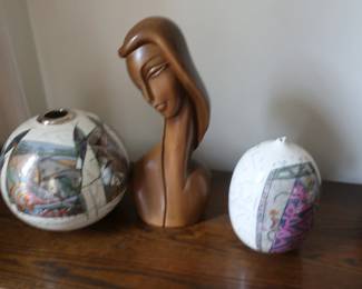pottery and signed carved women's head
