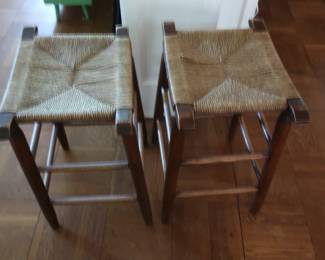 two wicker stools