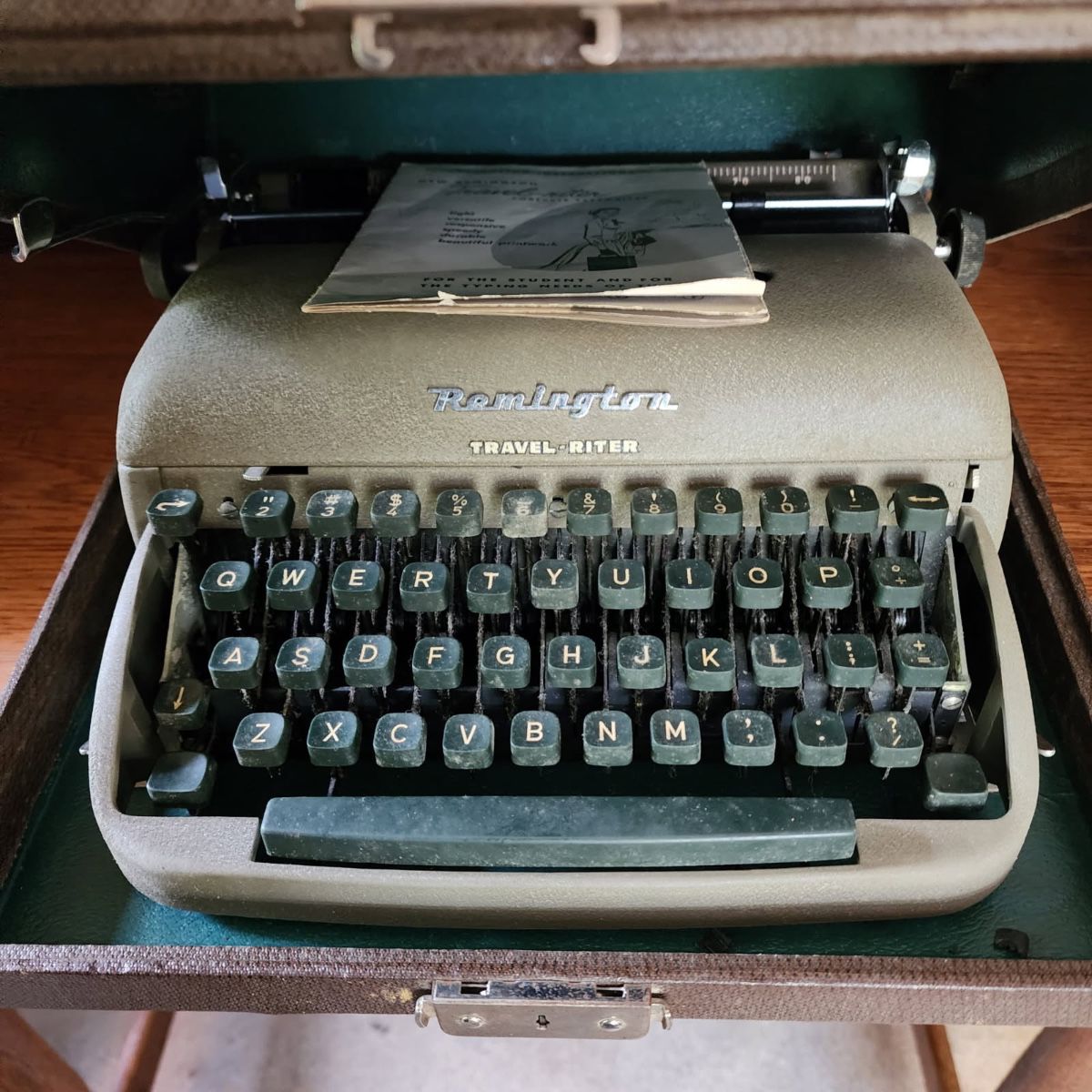 Multiple vintage and antique typewriters 