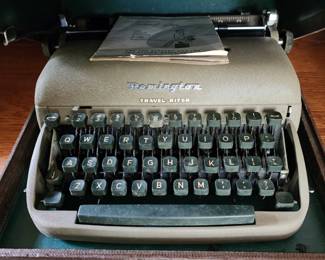 Multiple vintage and antique typewriters 
