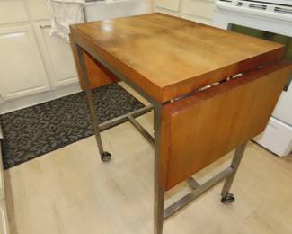 Kitchen prep table with drop leaves.