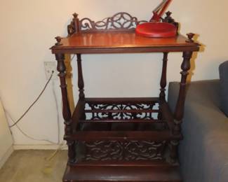 Antique end table with magazine rack.