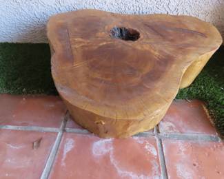 Large varnished tree trunk slab.
