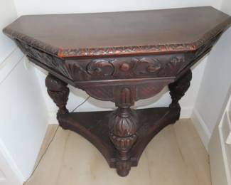 One of two antique entry/end tables.
