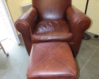 Leather armchair and footstool.