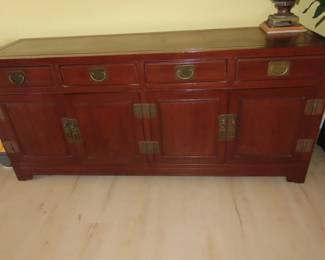 Asian style sideboard with shelves and drawers.